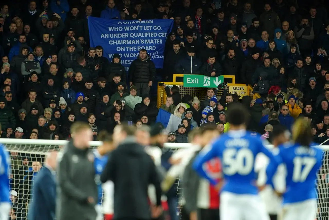 Everton fans hold up a protest banner