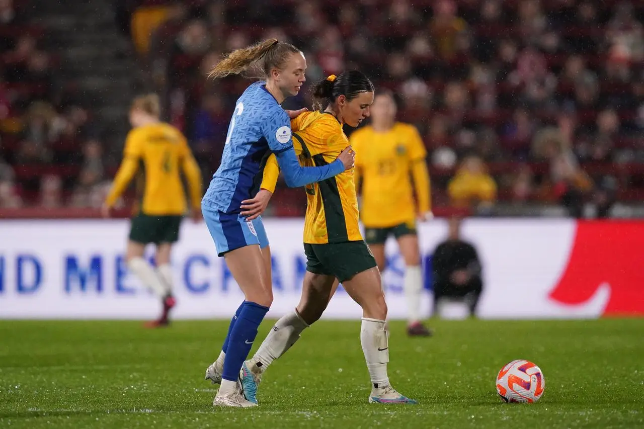 Esme Morgan (left) and Australia’s Hayley Raso battle for the ball (John Walton/PA)
