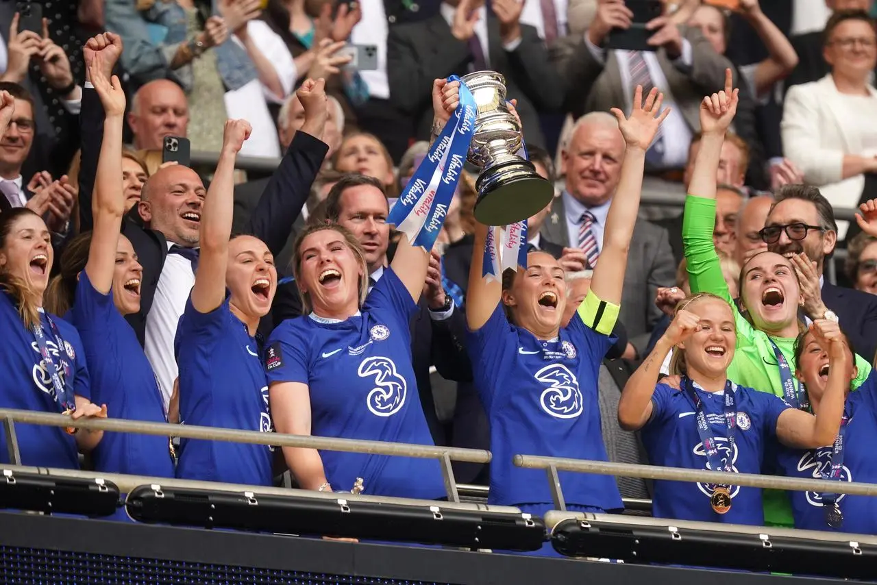Chelsea’s Millie Bright and Magdalena Eriksson lift the Women’s FA Cup at Wembley