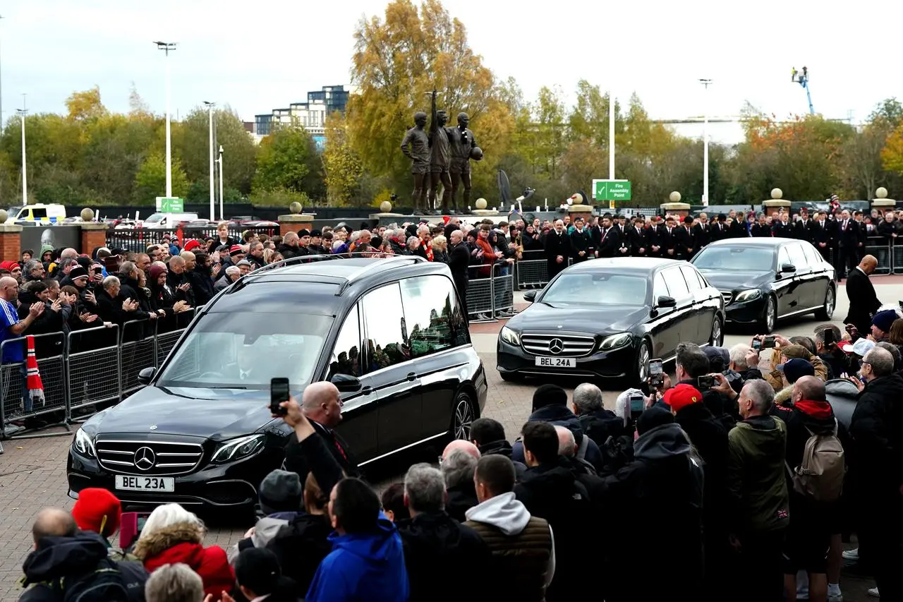 Sir Bobby Charlton's funeral cortege passes Old Trafford