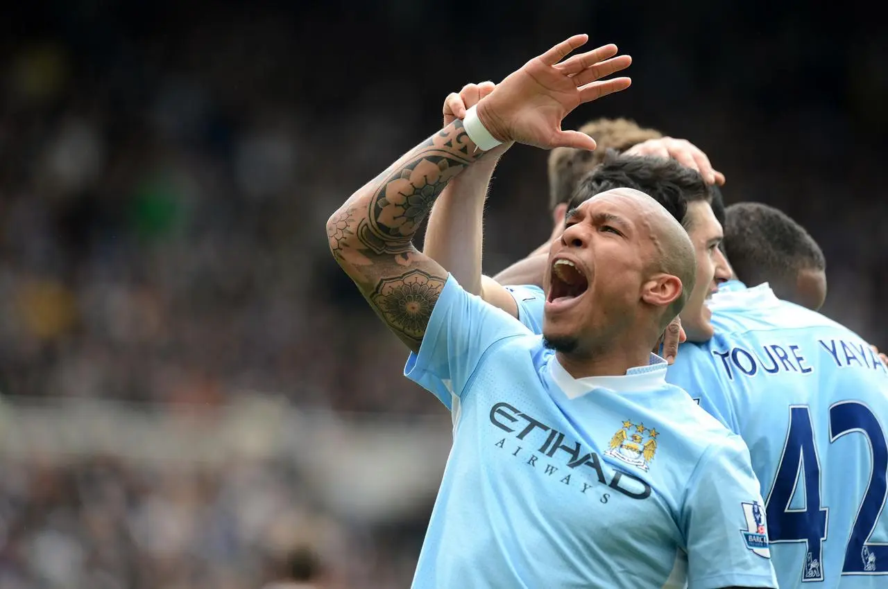 Nigel De Jong celebrates for Manchester City