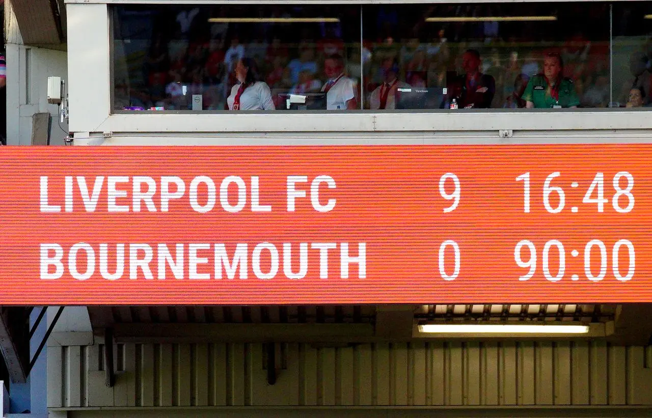 The scoreboard reads Liverpool 9 Bournemouth 0 at Anfield on August 27, 2022