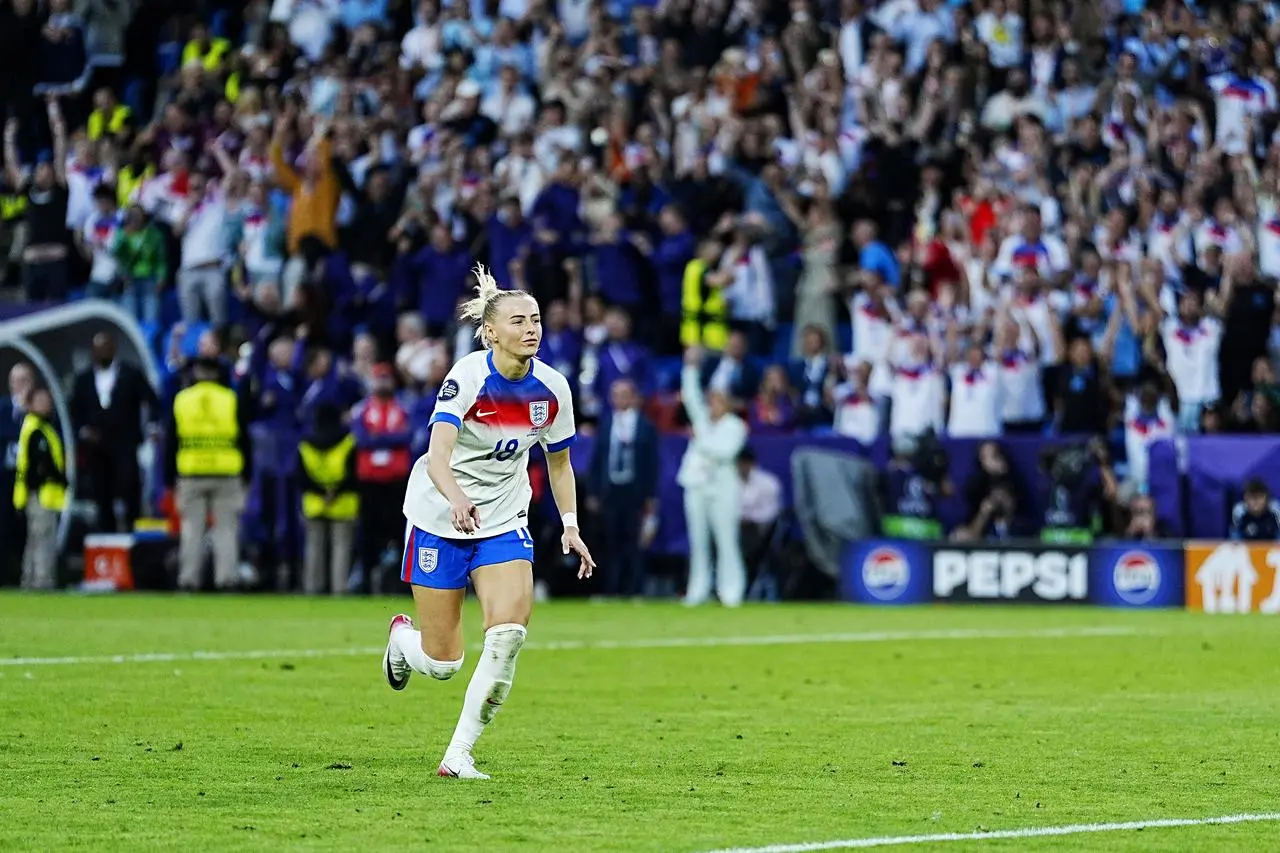 England’s Chloe Kelly celebrates after scoring the winning penalty