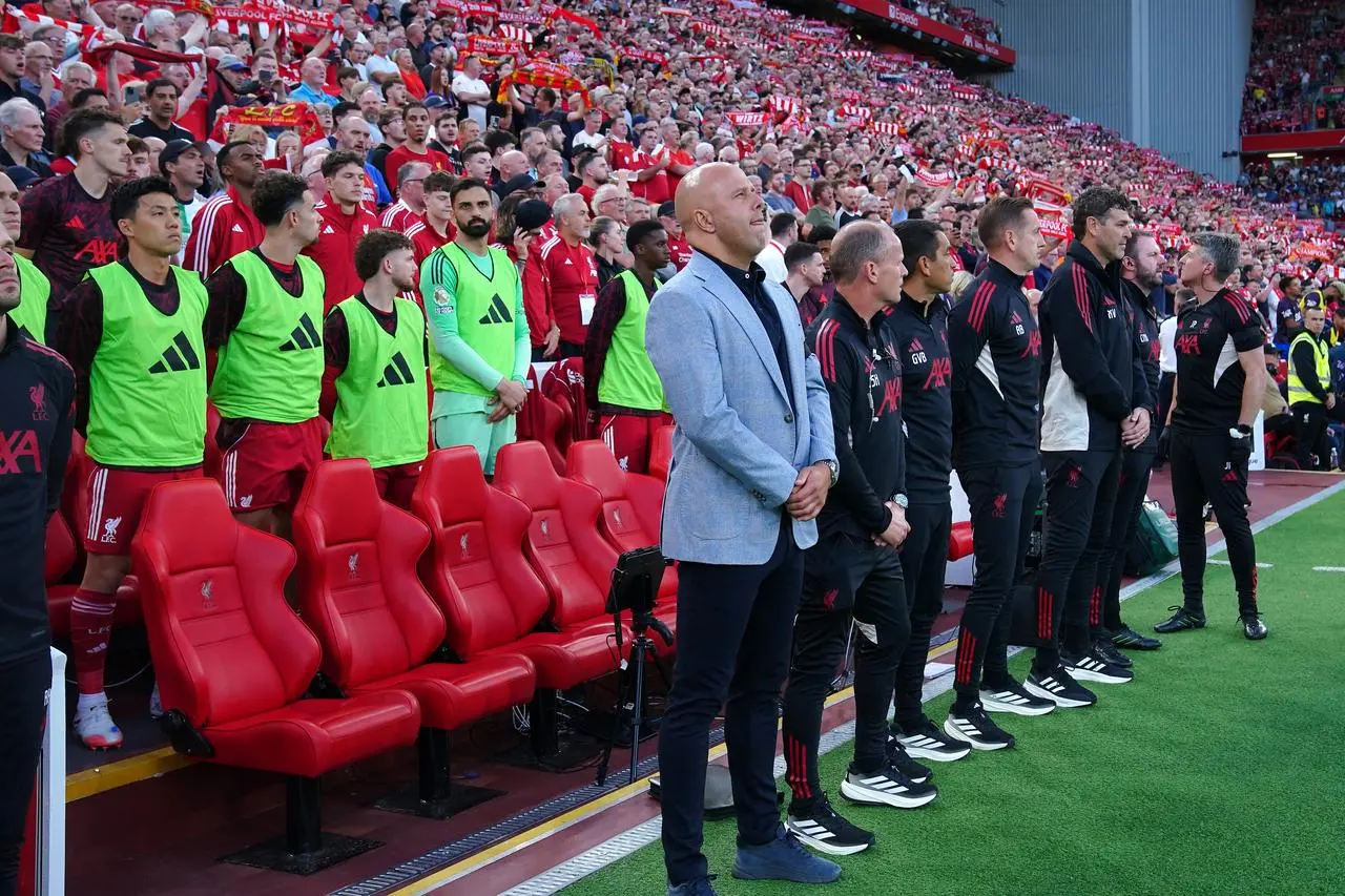 Liverpool manager Arne Slot (centre) stands during a minute’s silence in memory of Liverpool’s Diogo Jota