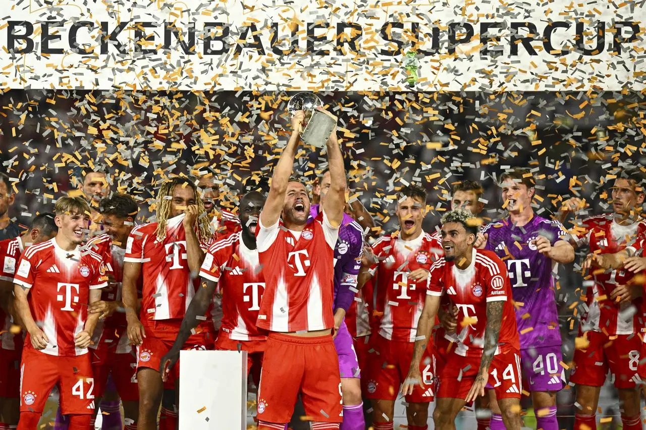 Harry Kane lifts the trophy