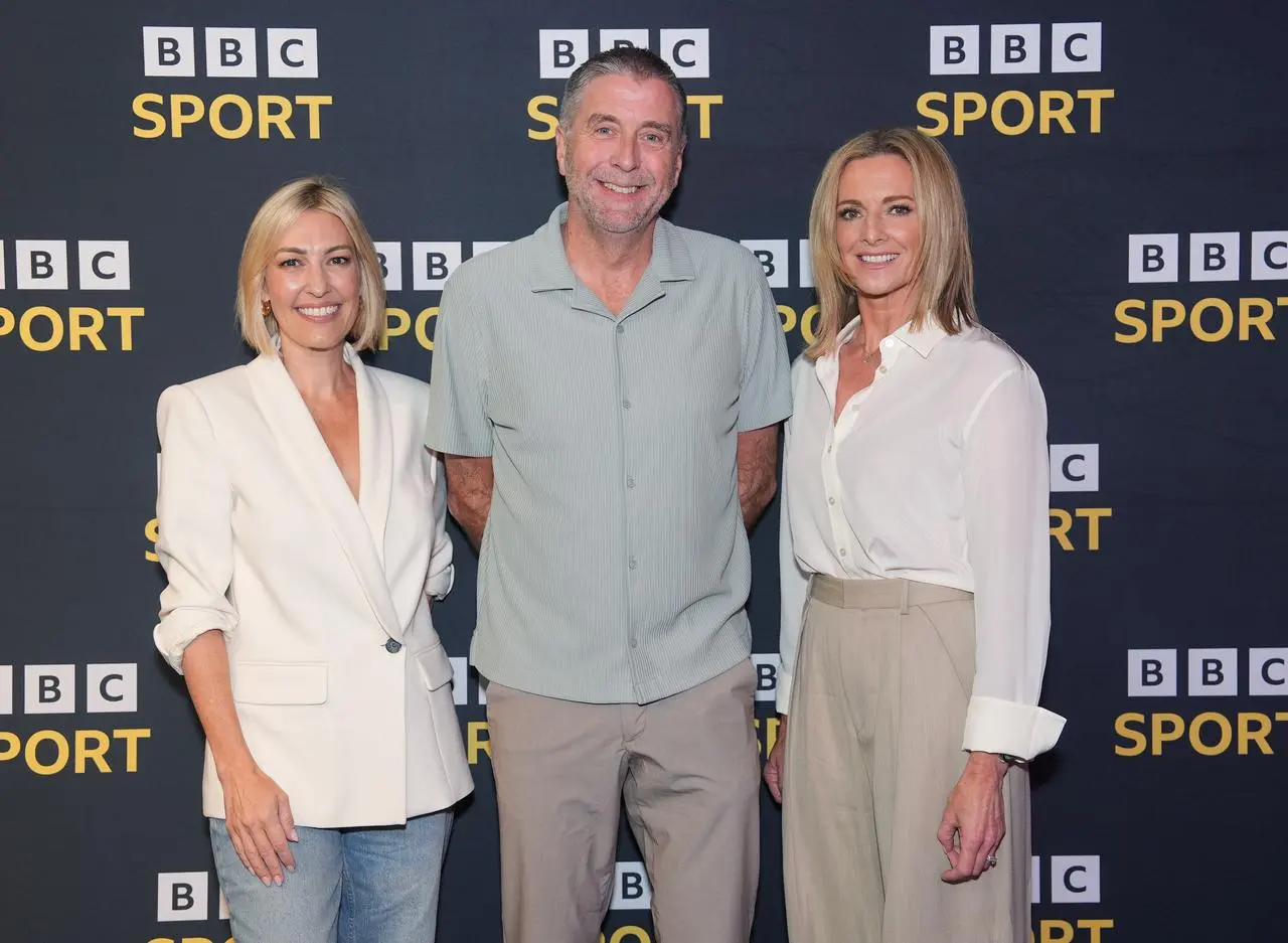 Kelly Cates, Mark Chapman and Gabby Logan pose for a photo