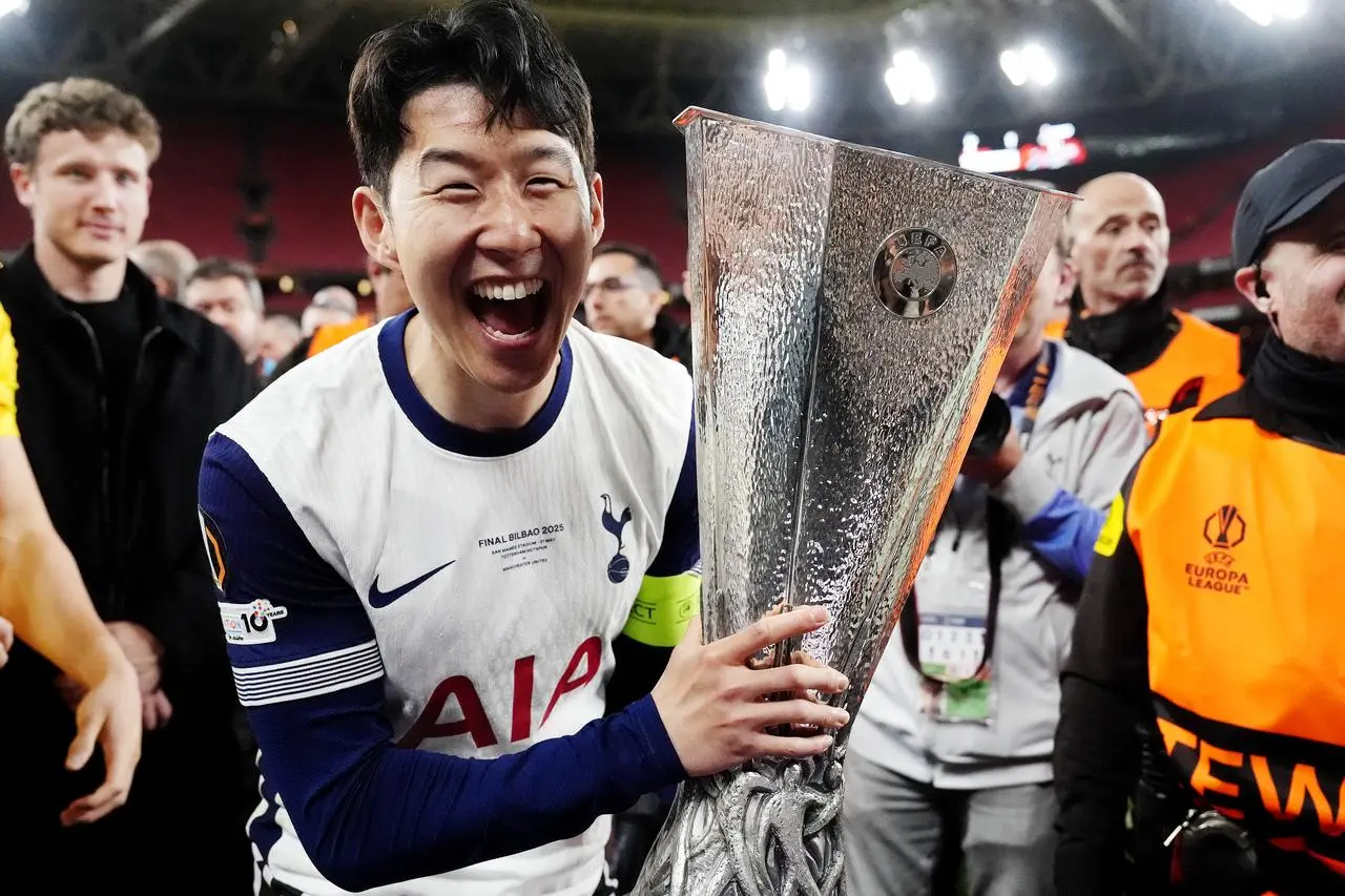 Tottenham's Son Heung-min celebrates Europa League glory with trophy