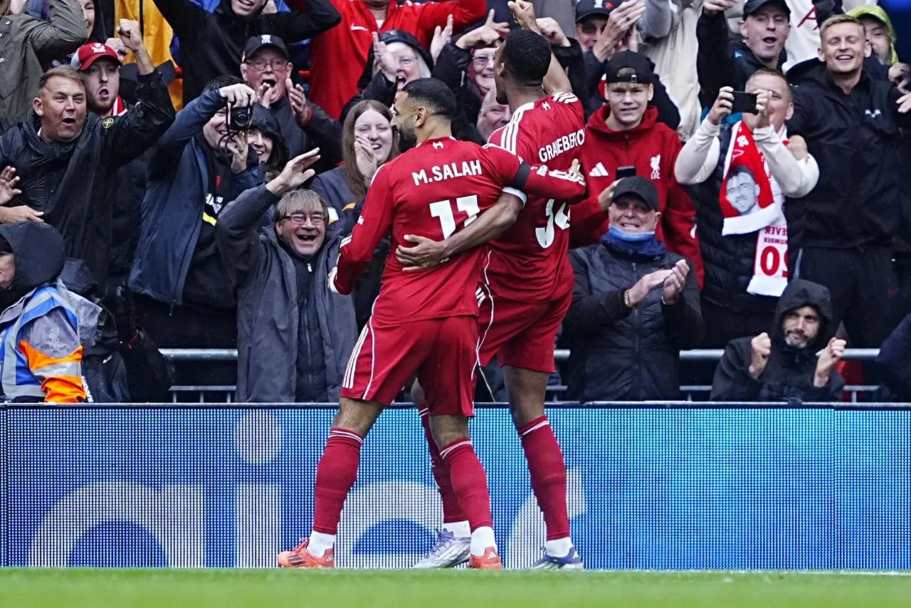 Ryan Gravenberch (right) celebrates scoring with team-mate Mohamed Salah