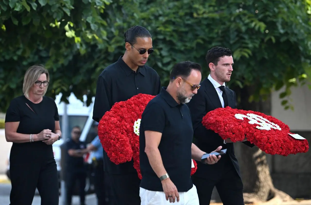 Liverpool captain Virgil Van Dijk and Andy Robertson (right) arrive at the funeral of Diogo Jota and Andre Silva