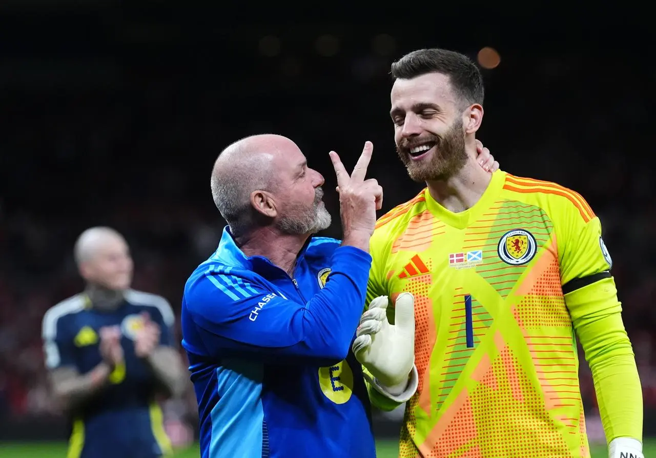 Steve Clarke greets Angus Gunn after his clean sheet in Denmark