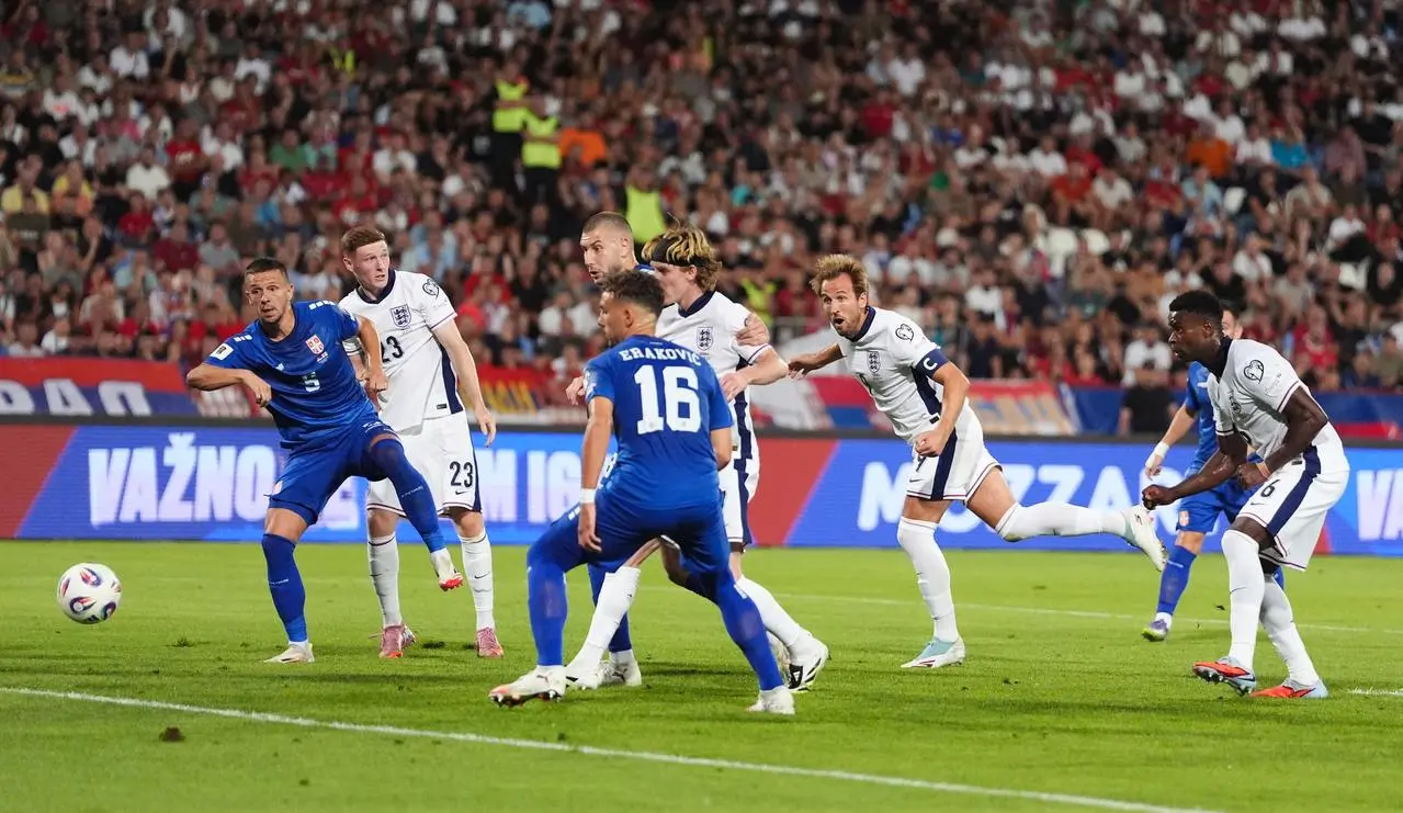 Harry Kane heads home England's opener