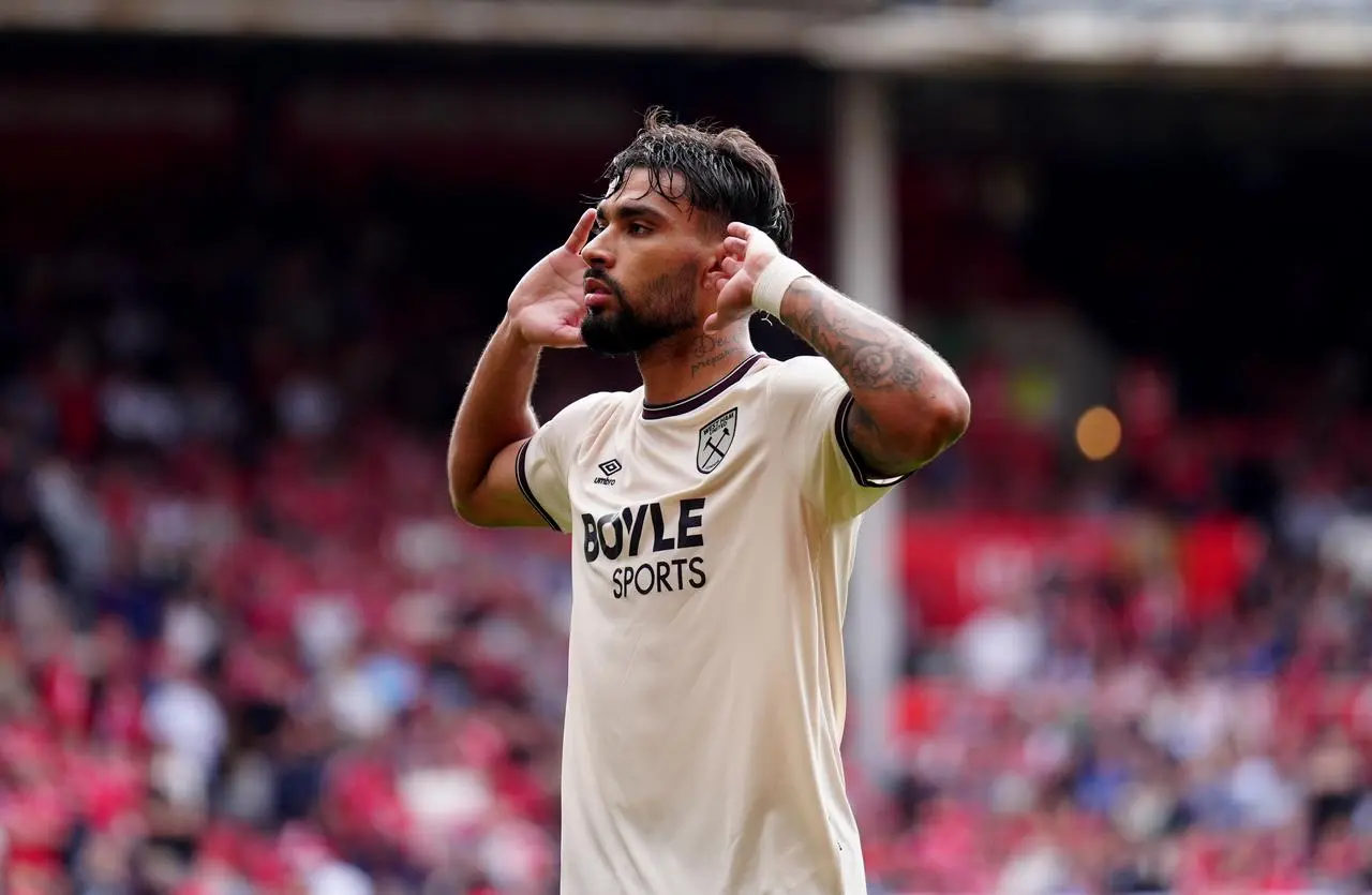 West Ham's Lucas Paqueta cups his hands to his ears in celebration