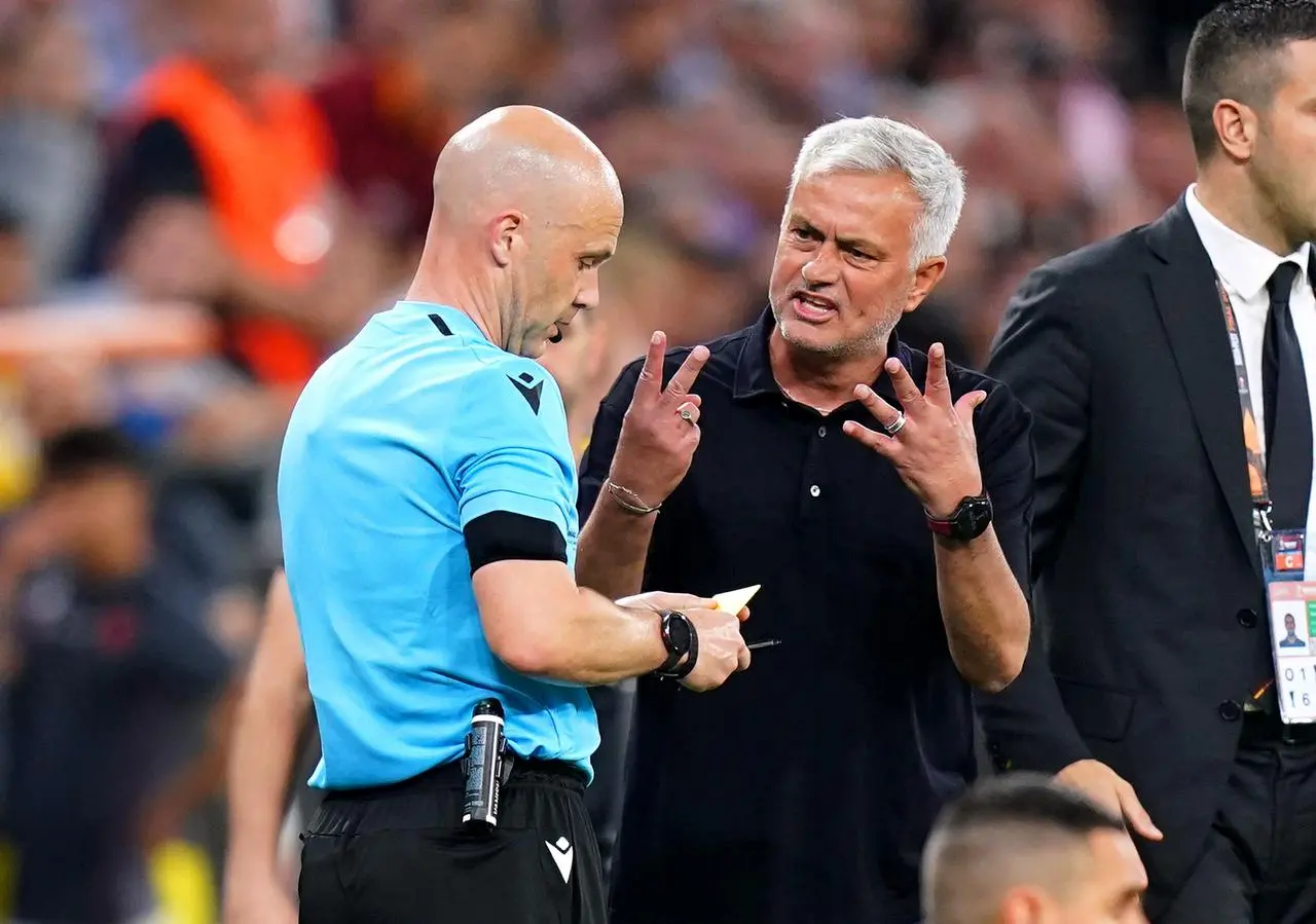 Roma manager Jose Mourinho exchanges words with referee Anthony Taylor during the 2023 Europa League final