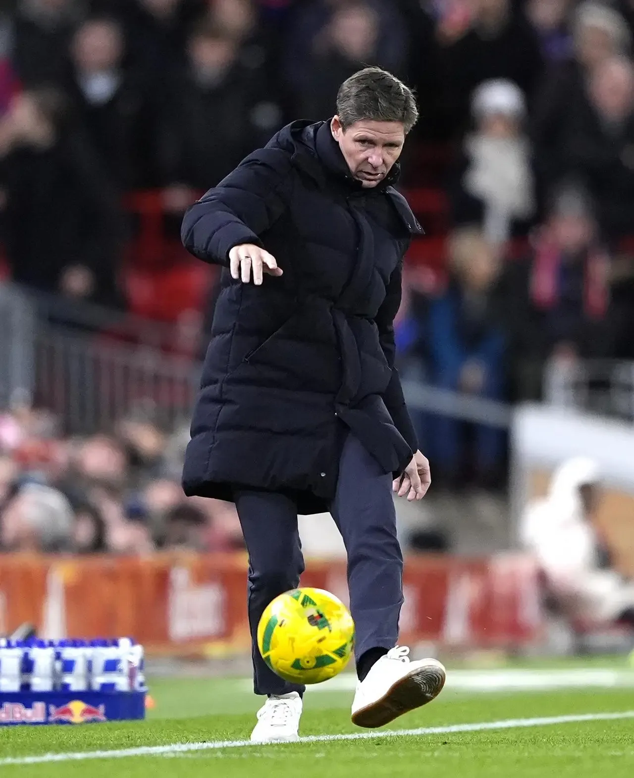 Crystal Palace manager Oliver Glasner sidefoots a ball that came into his technical area at Anfield