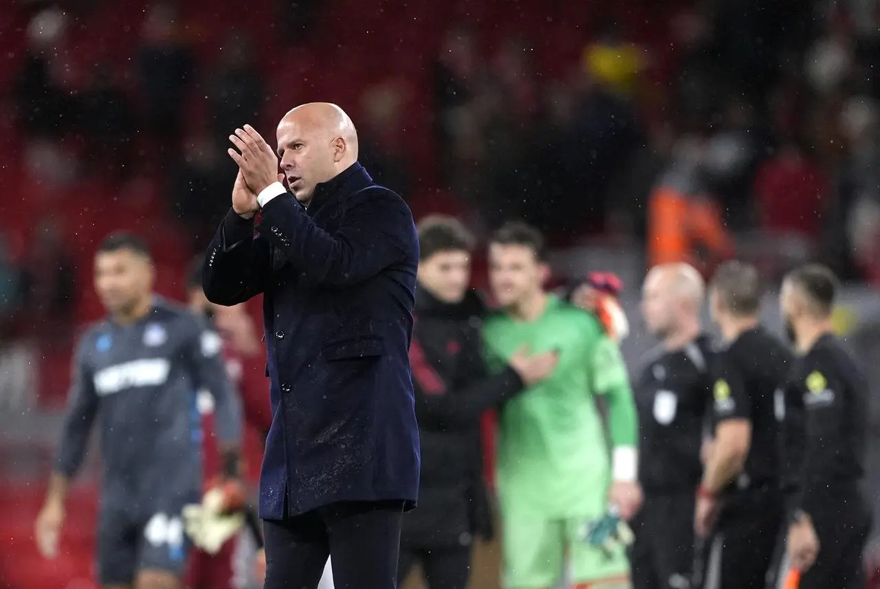 Liverpool manager Arne Slot applauds the fans following defeat to Crystal Palace