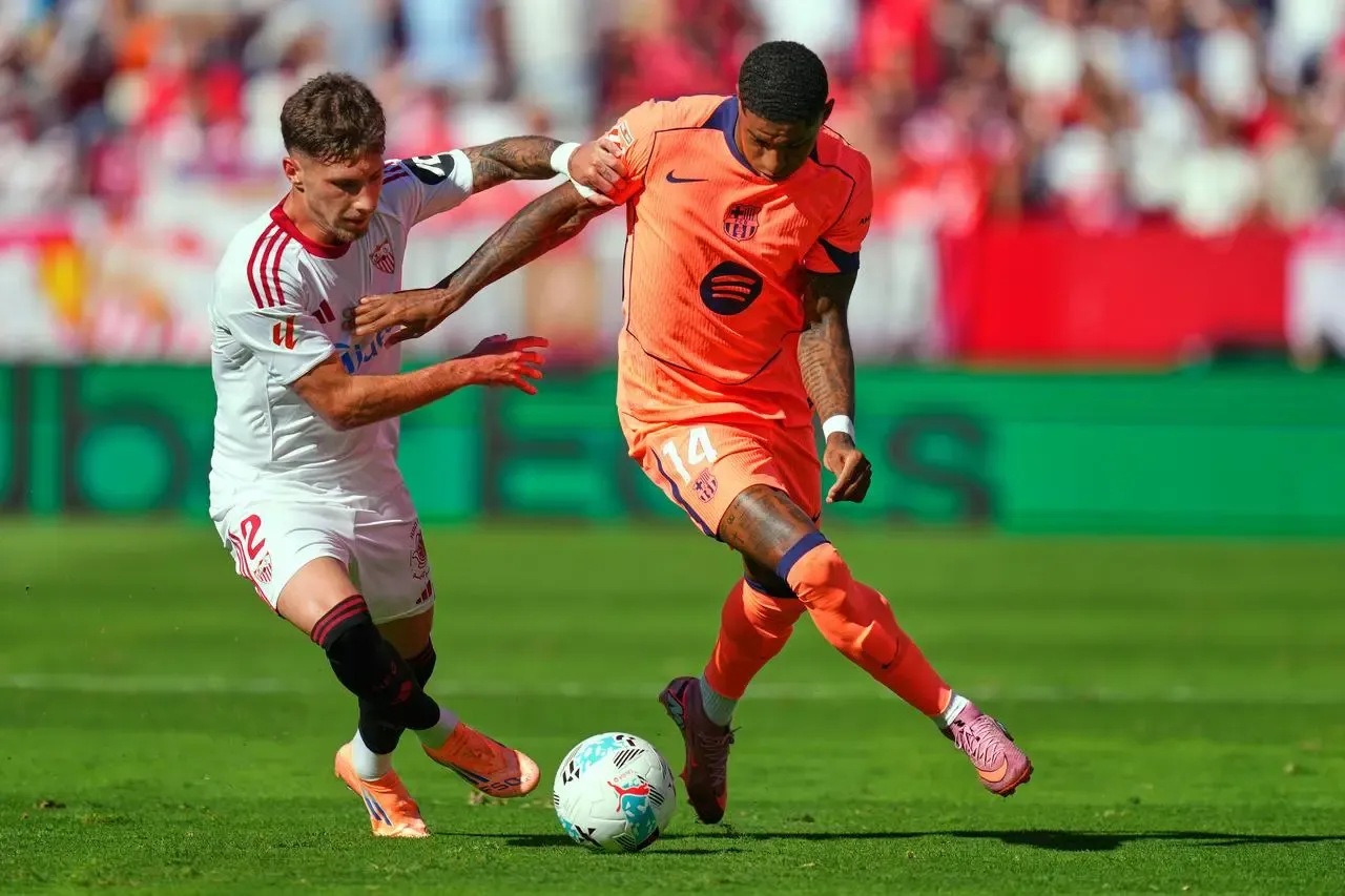 Marcus Rashford, right, challenges for the ball