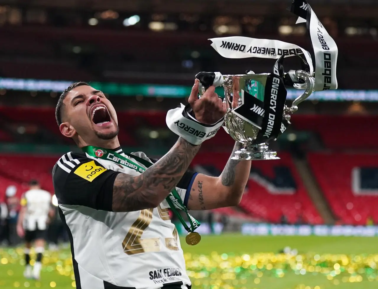 Newcastle captain Bruno Guimaraes celebrates with the trophy after a 2-1 Carabao Cup final victory over Liverpool