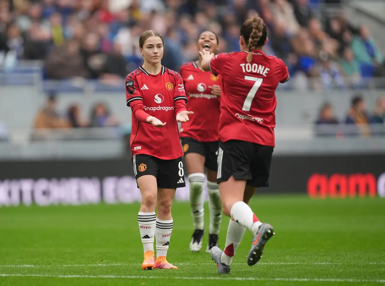 Manchester United’s Jess Park celebrates with team-mates after scoring