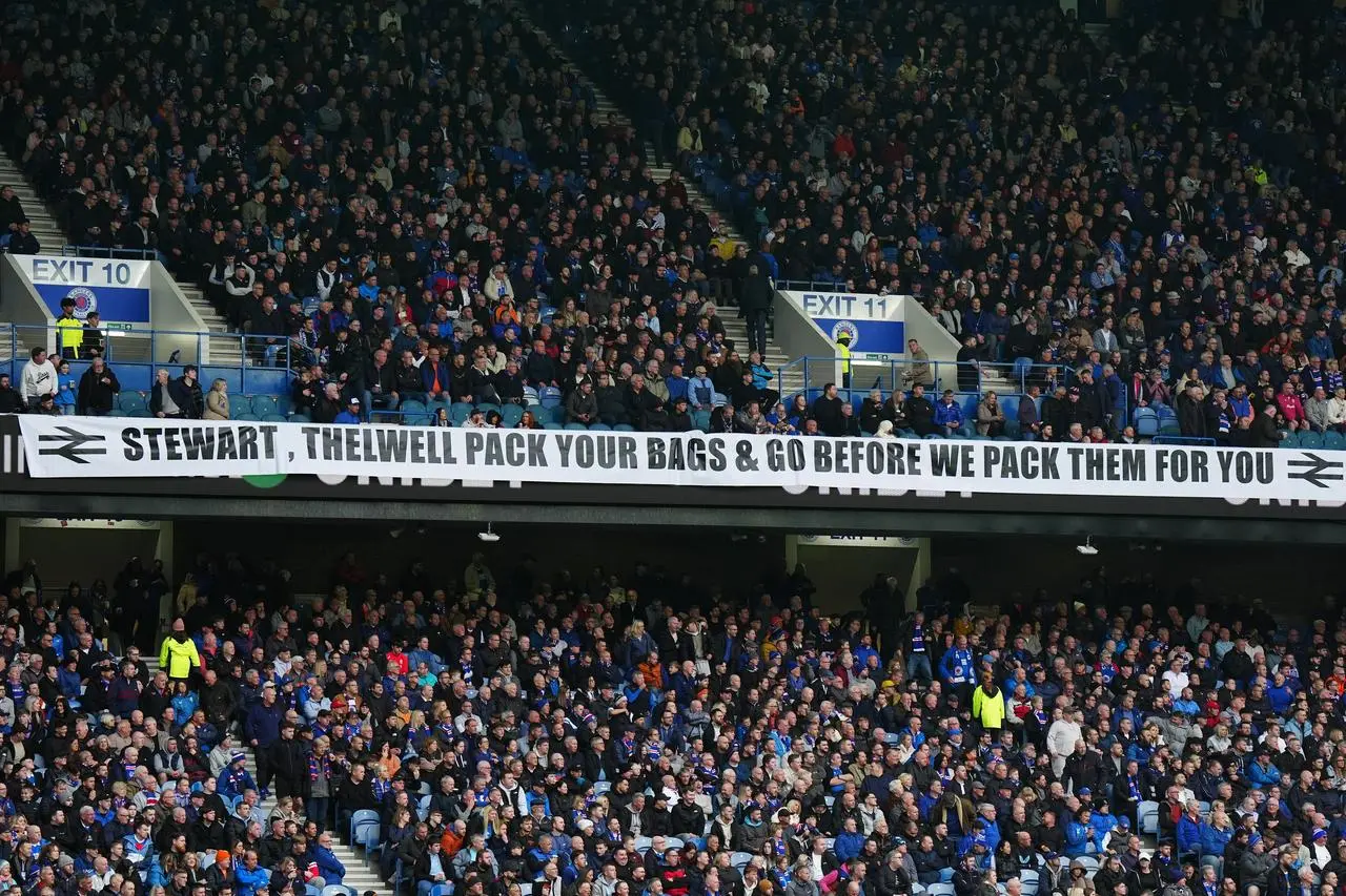 Rangers’ fans display a banner during the William Hill Premiership match at Ibrox