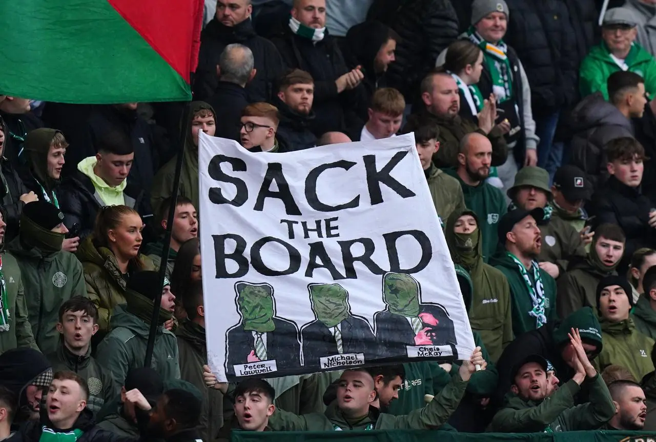 Celtic fans with a 'Sack the Board' banner