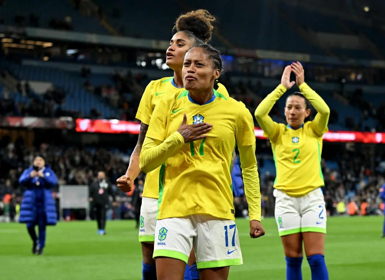 Brazil players celebrate victory over England at the Etihad Stadium