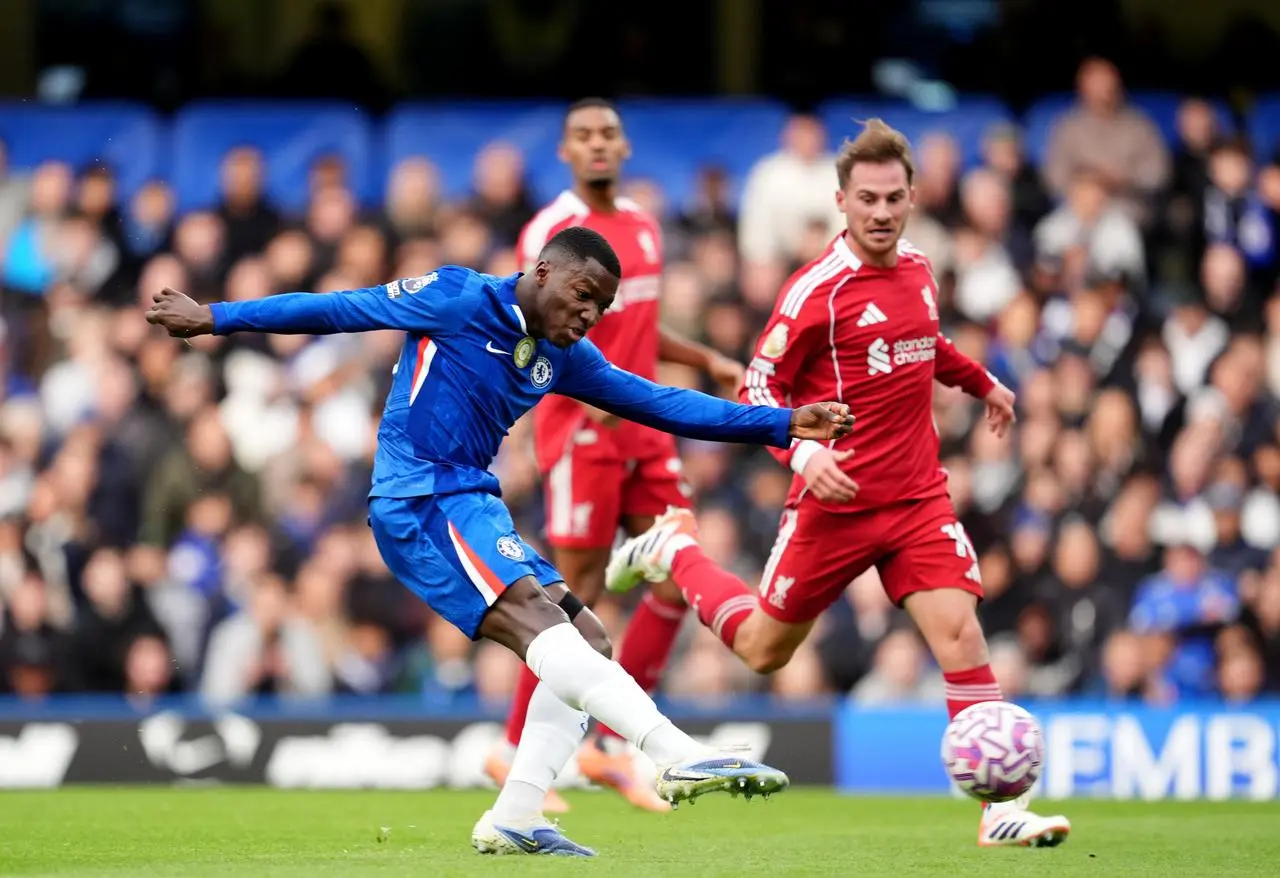 Moises Caicedo strikes the ball from 20 yards to give Chelsea the lead as Liverpool's Alexis Mac Allister looks on