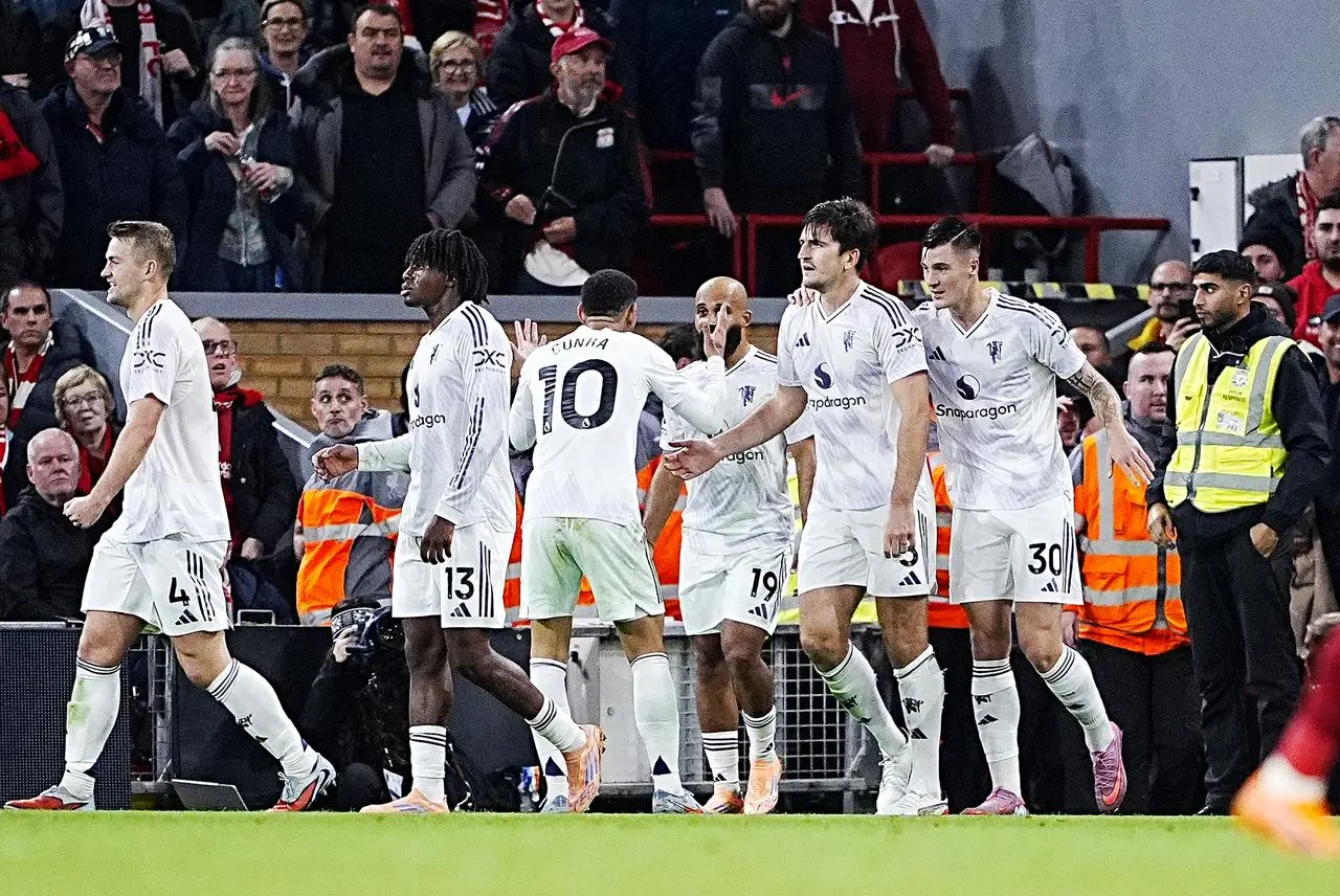 Harry Maguire, second right, celebrates with team-mates after scoring Manchester United’s winner at Liverpool