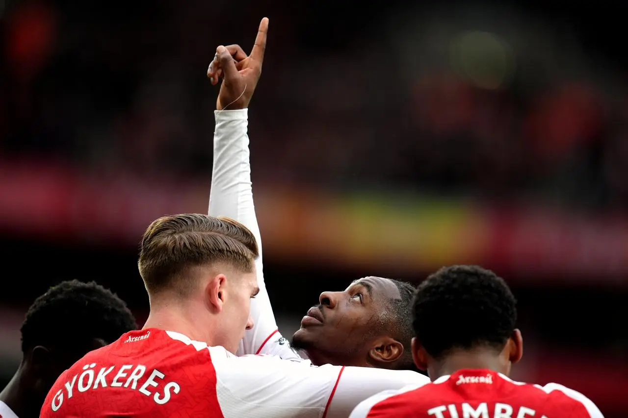 Arsenal’s Eberechi Eze, centre, points to the sky after scoring against Crystal Palace