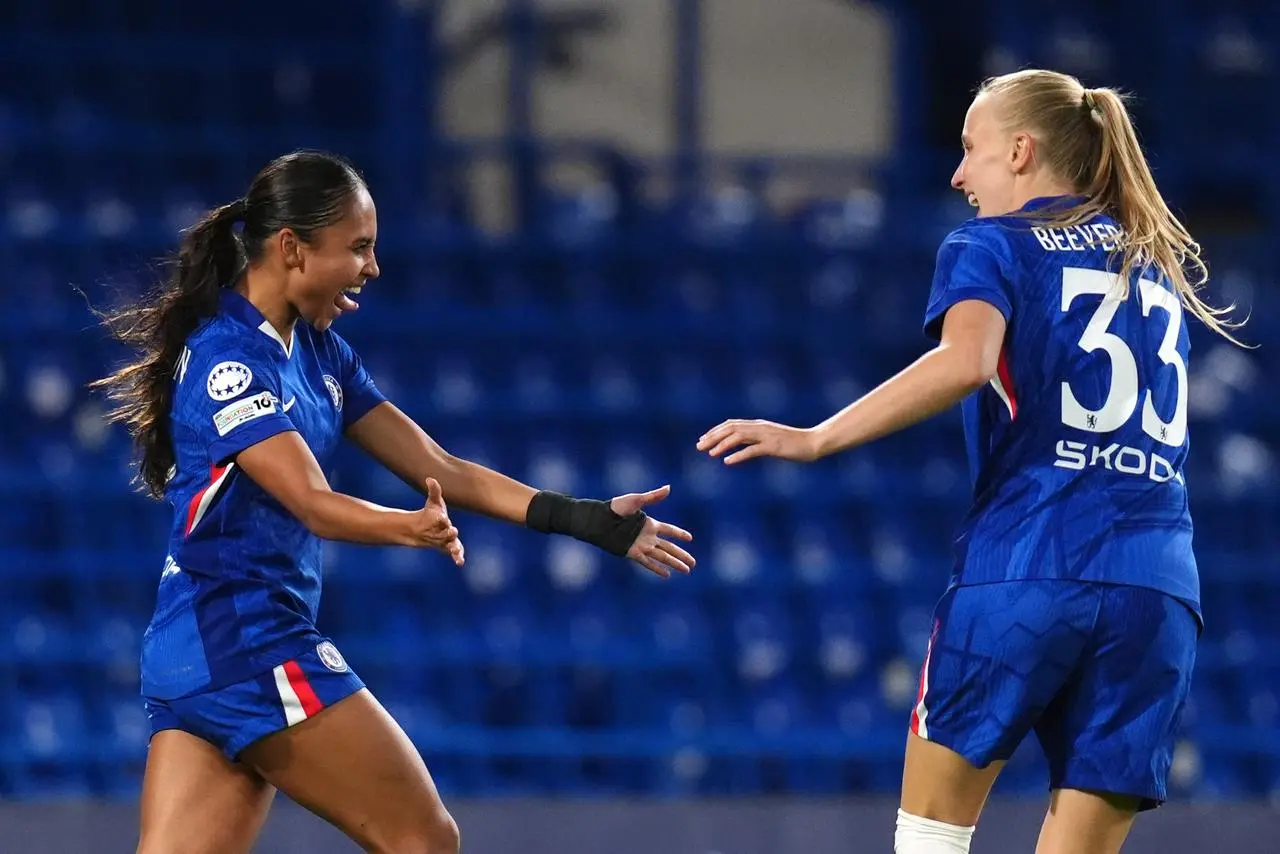 Chelsea’s Alyssa Thompson (left) celebrates scoring