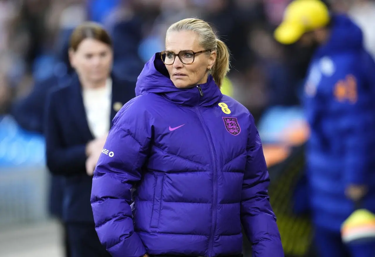 Sarina Wiegman looks on from the touchline during England's defeat to Brazil