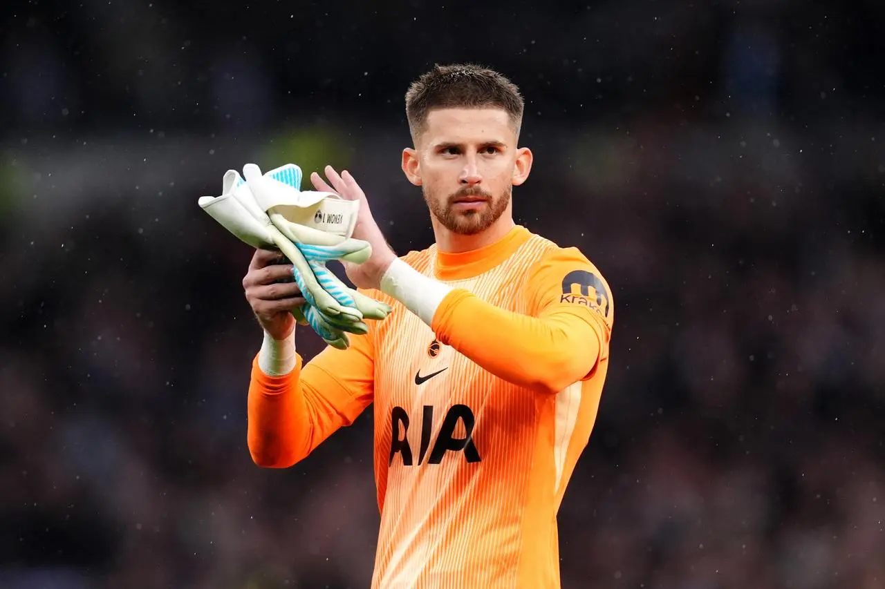Tottenham goalkeeper Guglielmo Vicario applauds the fans following a Premier League match against Aston Villa