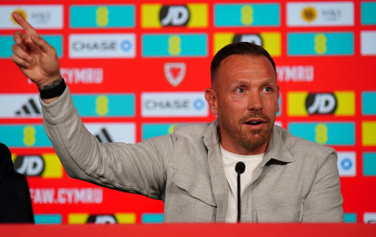 Craig Bellamy points with his right hand