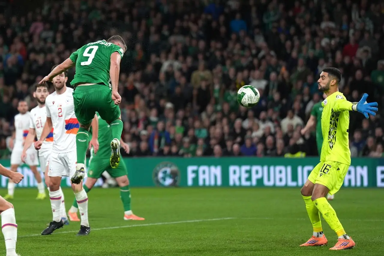 Republic of Ireland’s Evan Ferguson scores a header against Armenia