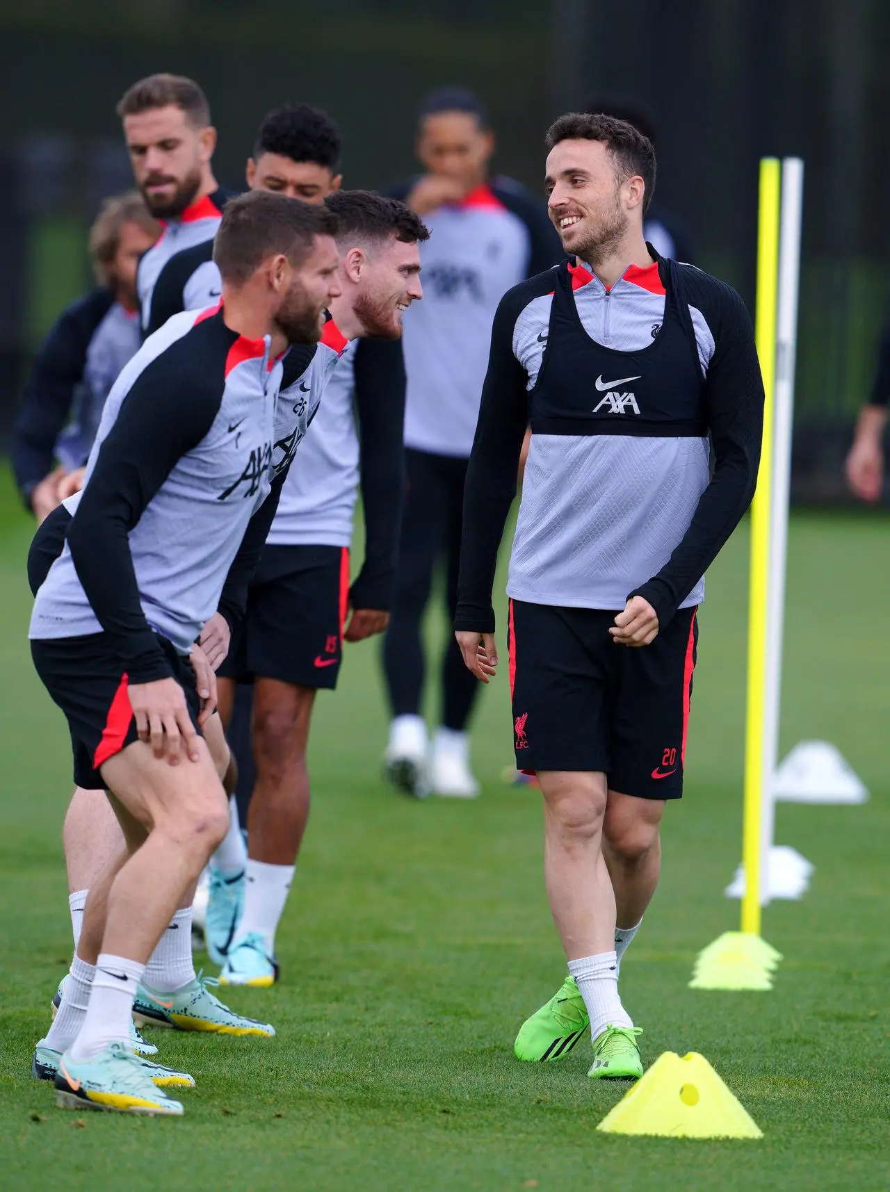 Diogo Jota, right, with Andy Robertson and James Milner, left, during a Liverpool training session