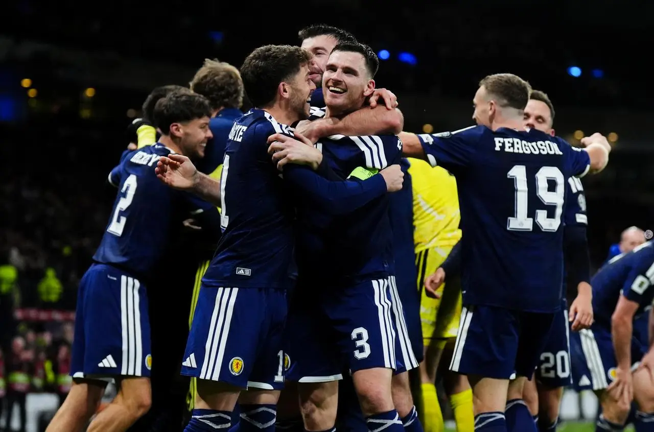 Andy Robertson celebrates with Ryan Christie