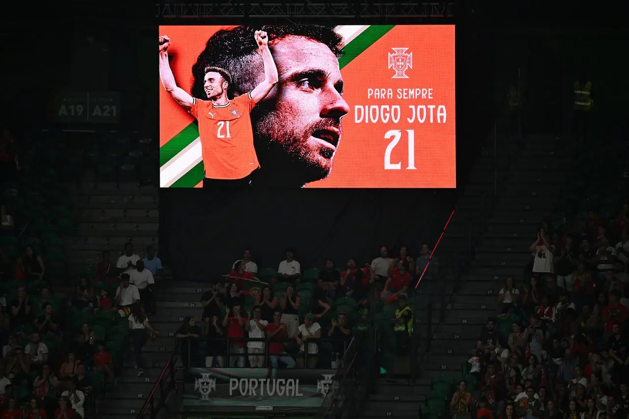 Tributes are made to former Portugal and Liverpool player Diogo Jota during the twenty first minute