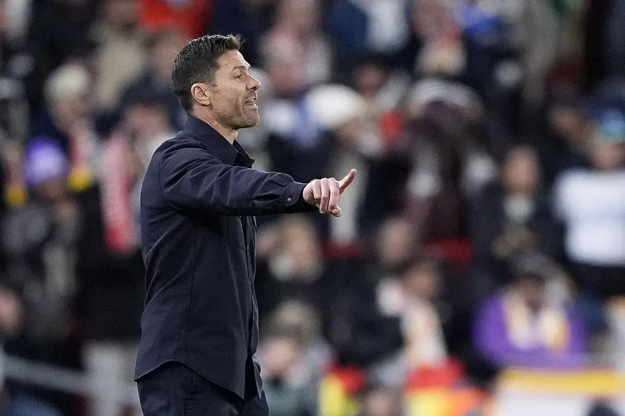 Real Madrid manager Xabi Alonso gestures on the touchline against Liverpool