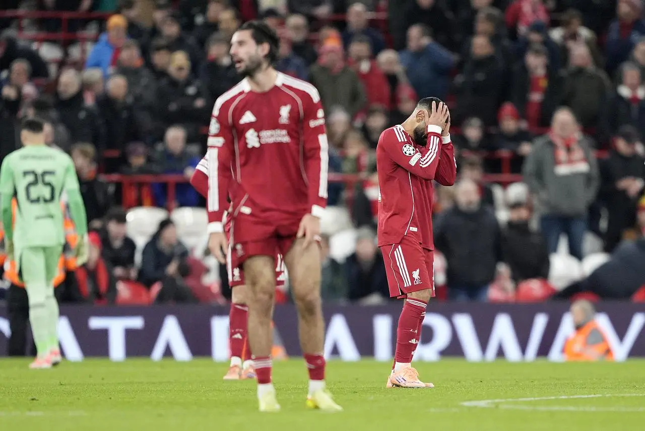 Liverpool players react