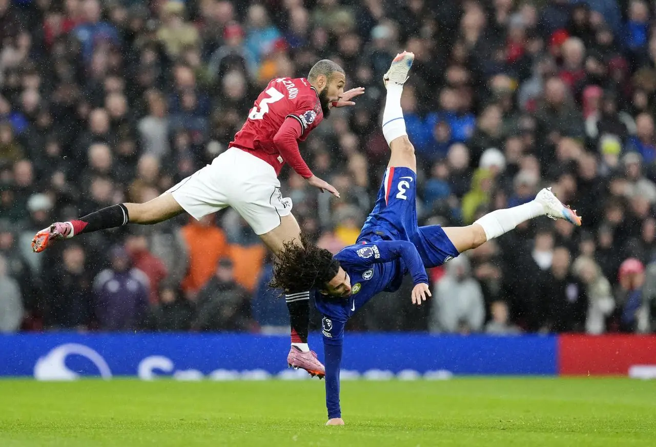 Manchester United’s Noussair Mazraoui battles for the ball