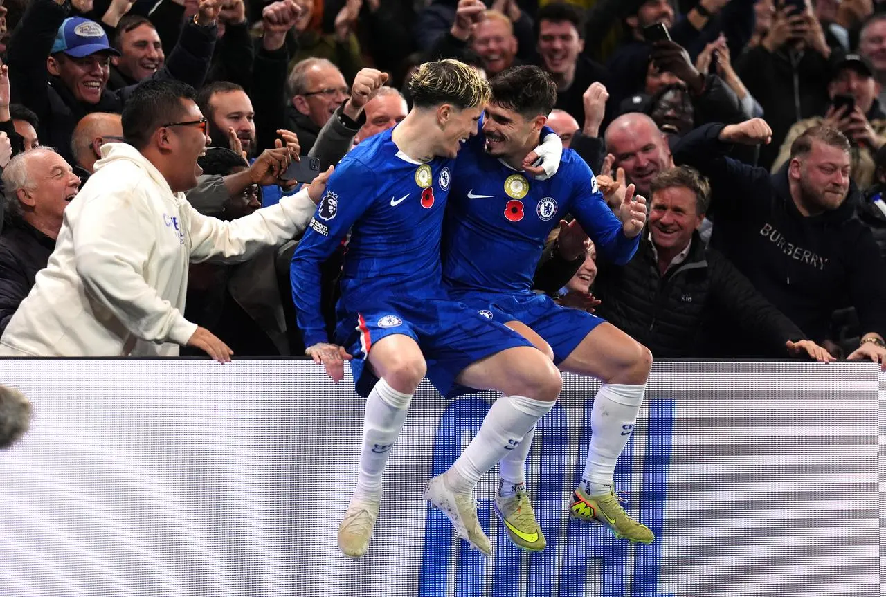 Pedro Neto, right, celebrates his goal with Alejandro Garnacho