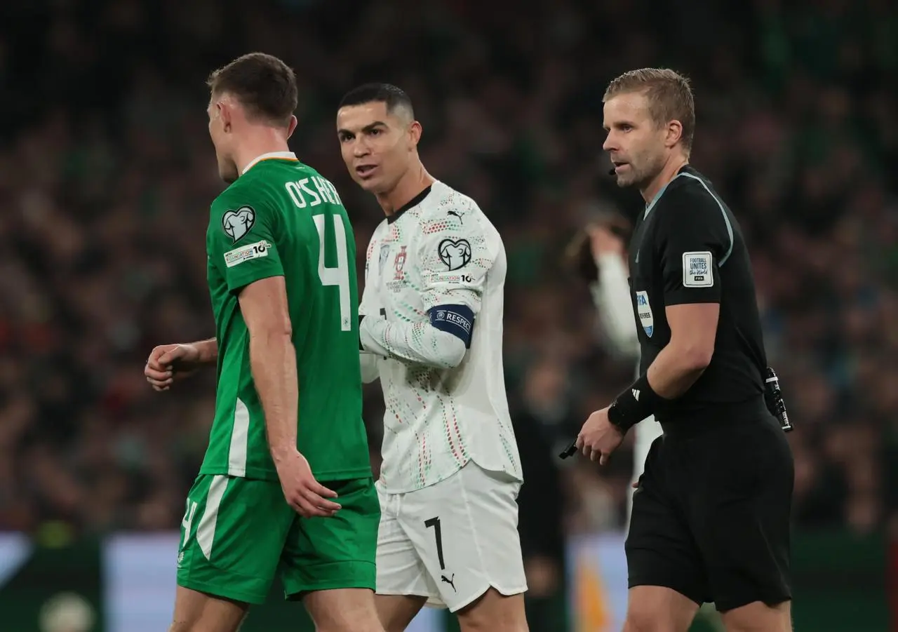 Cristiano Ronaldo speaks to Ireland defender Dara O'Shea during a World Cup qualifier in Dublin