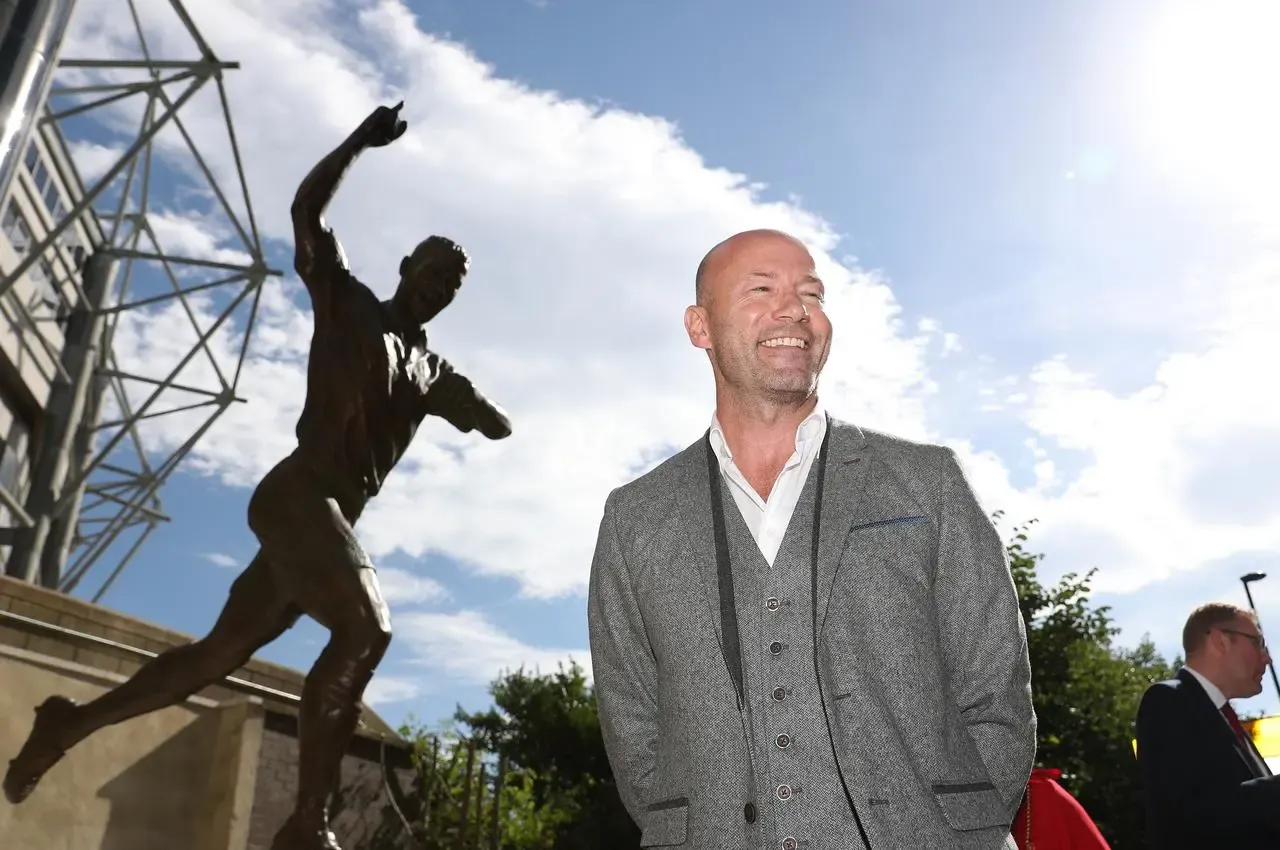 Alan Shearer poses for a photograph next to the newly unveiled statue of himself outside St James’ Park