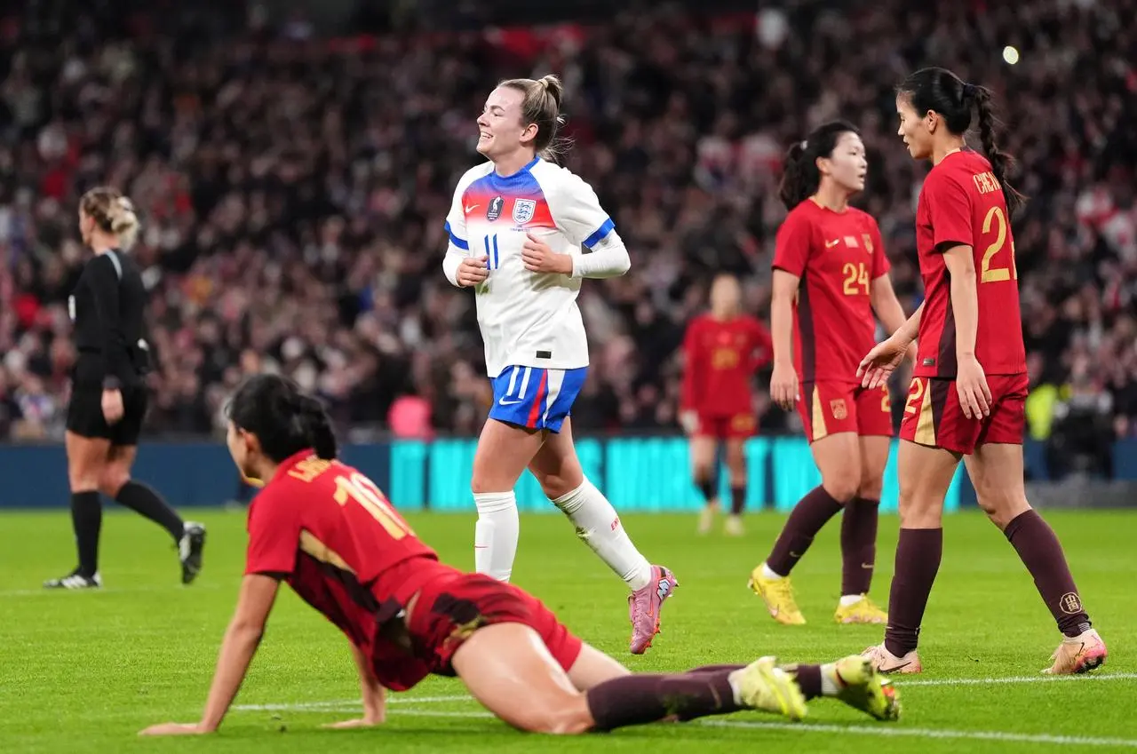 Lauren Hemp celebrates her goal