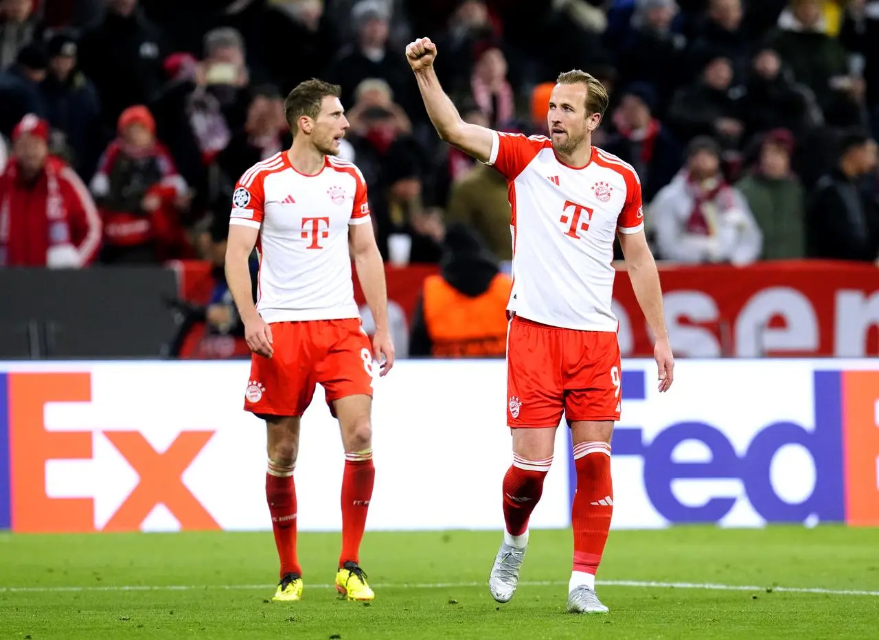 Bayern Munich’s Harry Kane (right) celebrates scoring at Arsenal