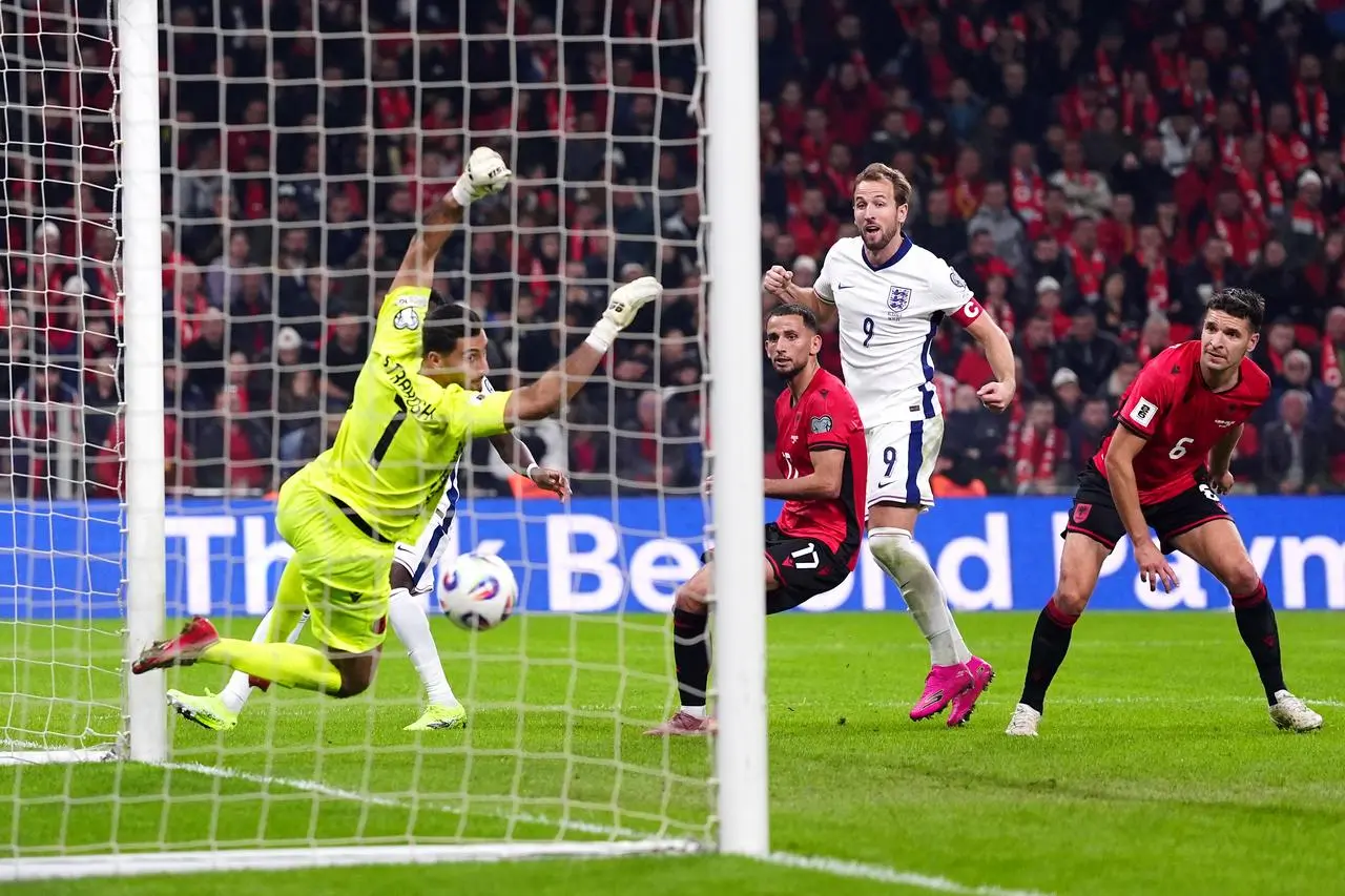 Harry Kane, second right, scores England's second