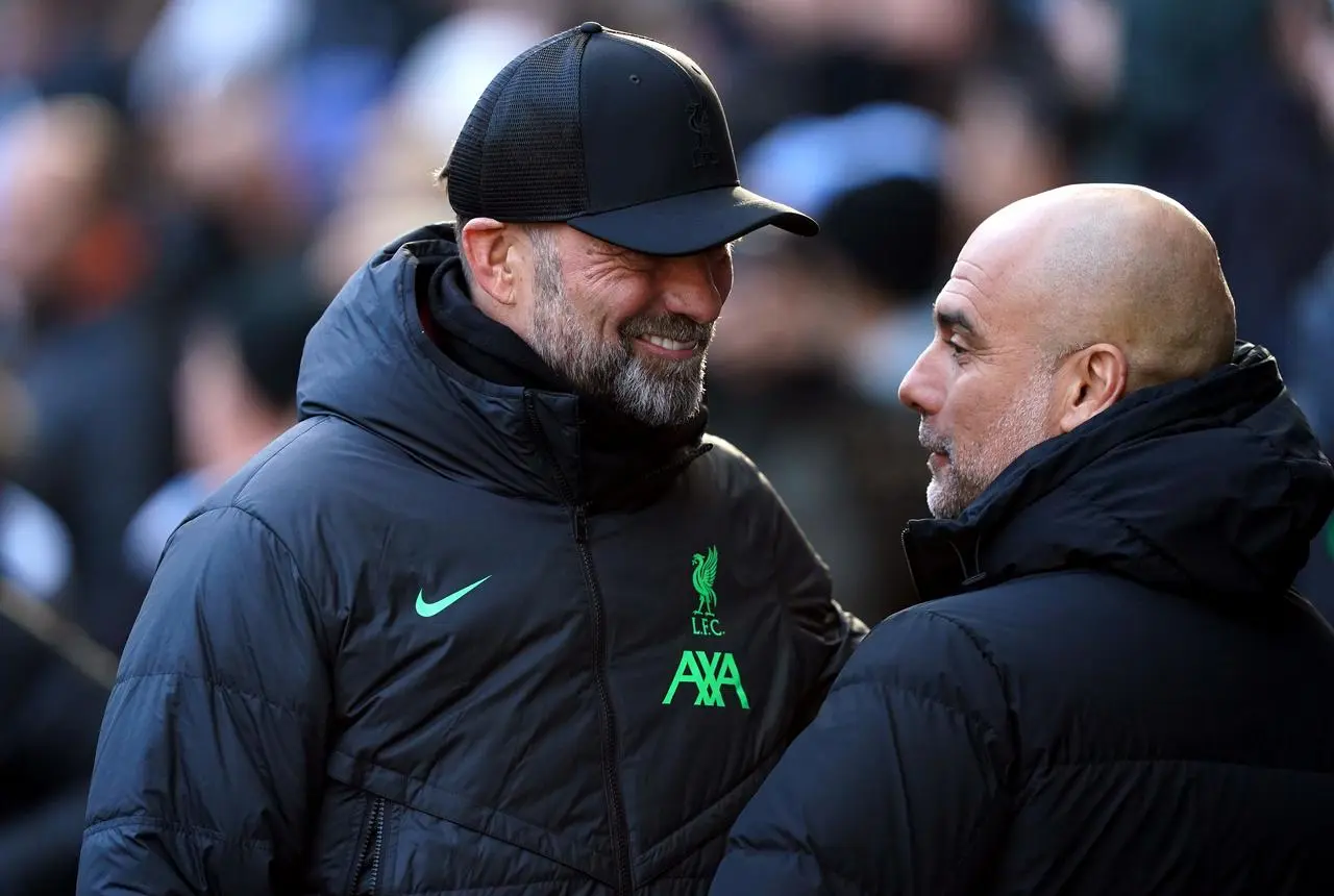 Jurgen Klopp and Pep Guardiola meet on the touchline