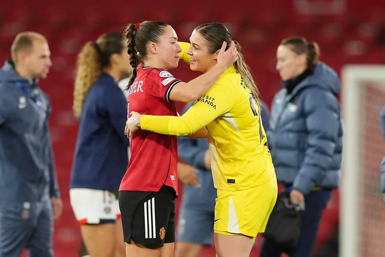 Paris St Germain goalkeeper Mary Earps (right) with Manchester United’s Maya Le Tissier