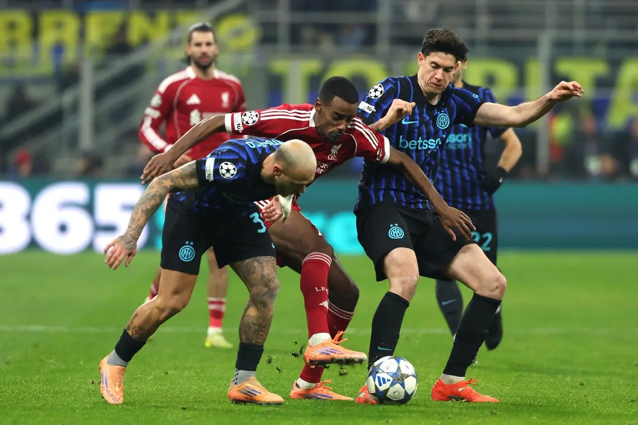 Alexander Isak (centre) battles for the ball