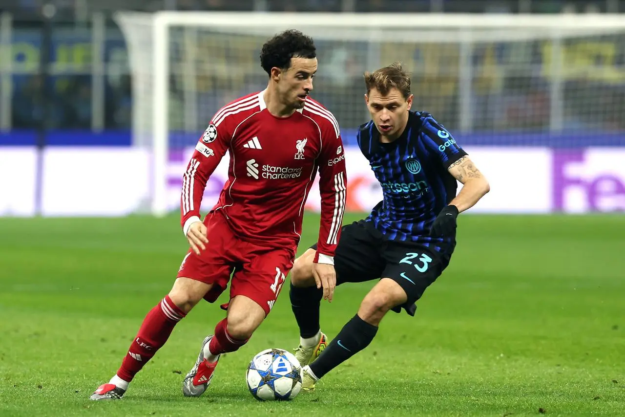 Jones (left) in action against Inter Milan