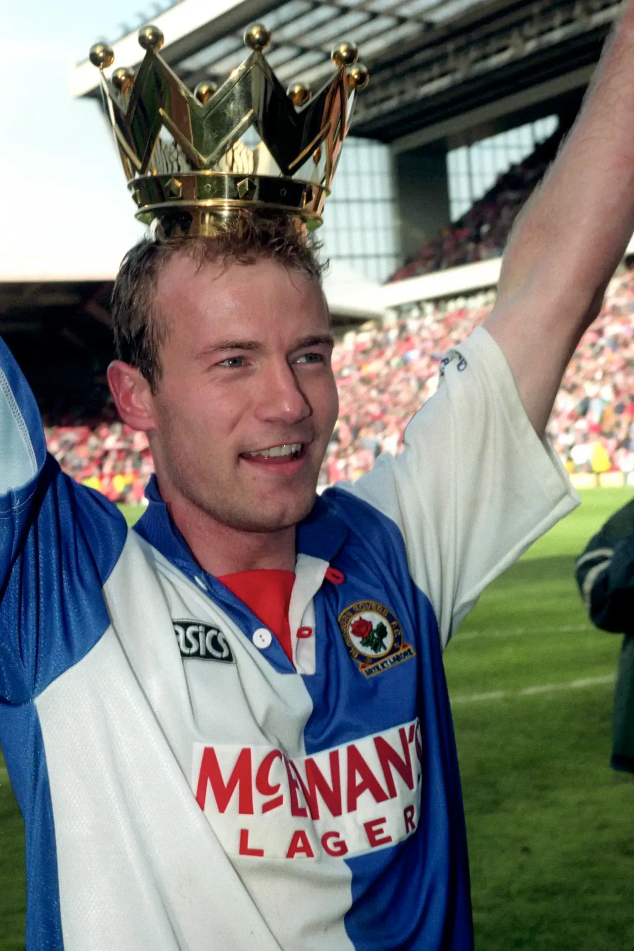Alan Shearer celebrates with the crown of the Premier League trophy on his head after Blackburn's 1995 title win